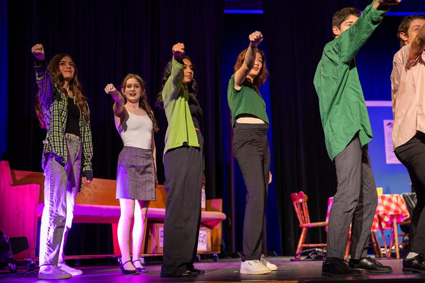 Students perform onstage